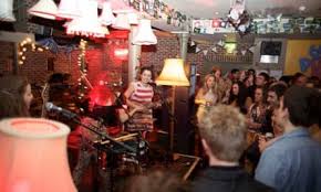 Close up of a guitarist performing at The Groove Lounge